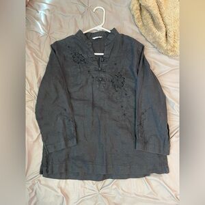 black blouse with floral embroidery